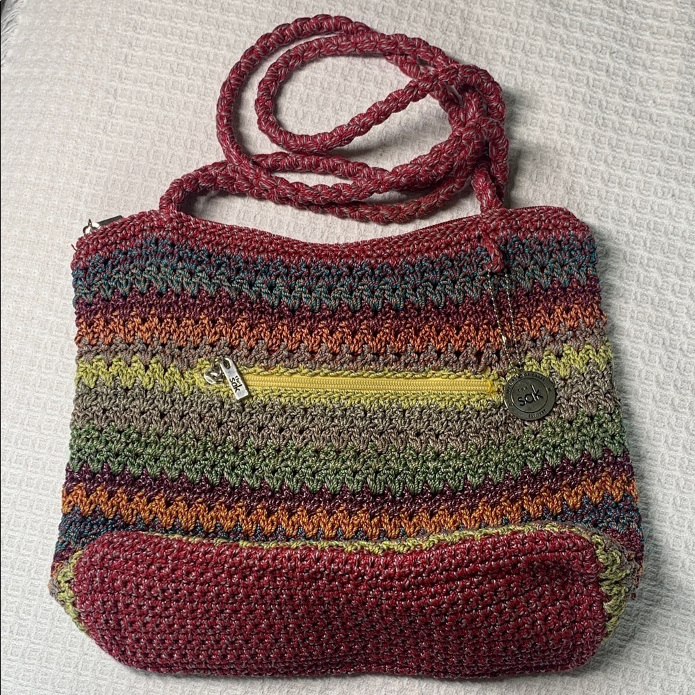 The Sak colorful striped woven shoulder bag with matching wristlet pouch
